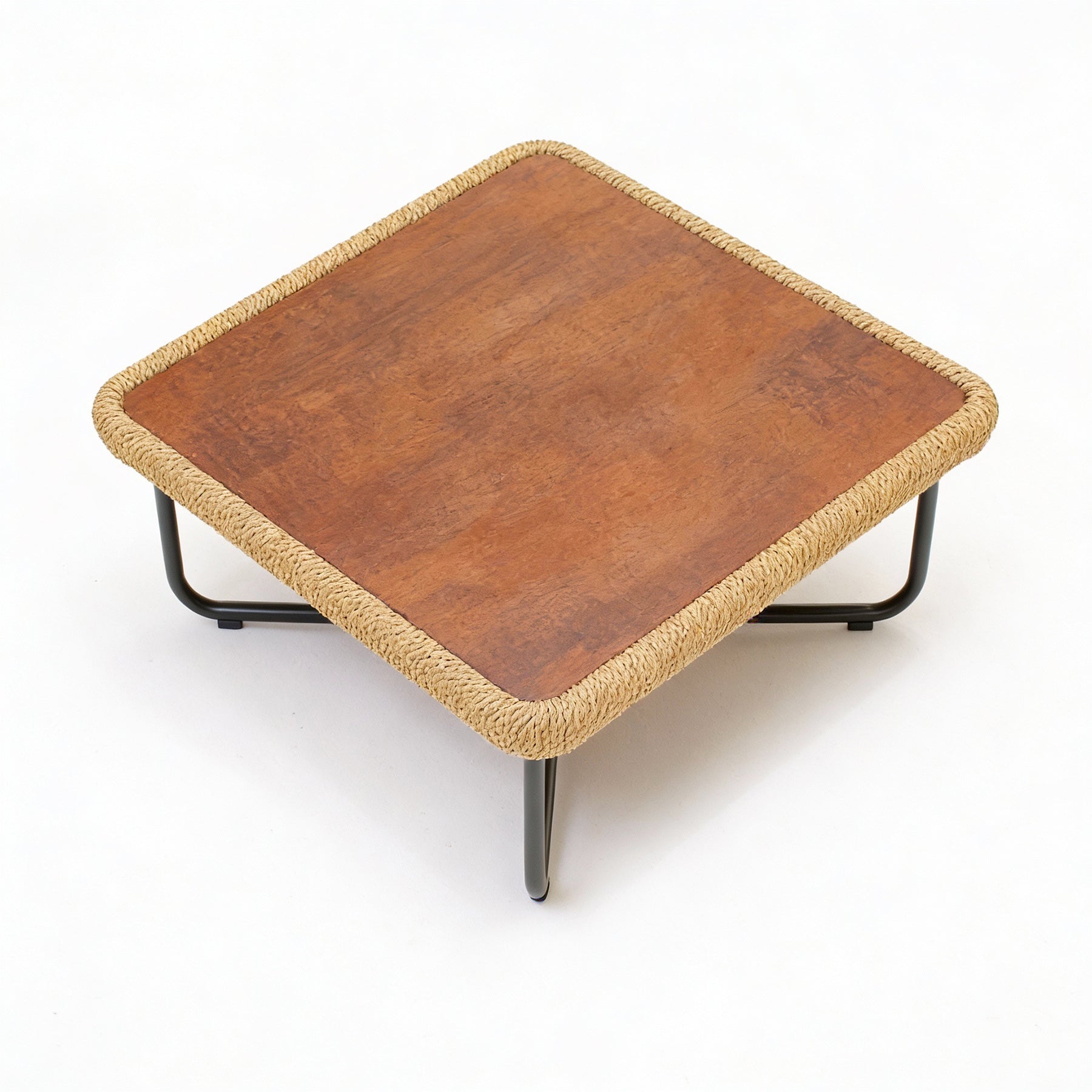Wooden table with woven edge and metal legs on a white background