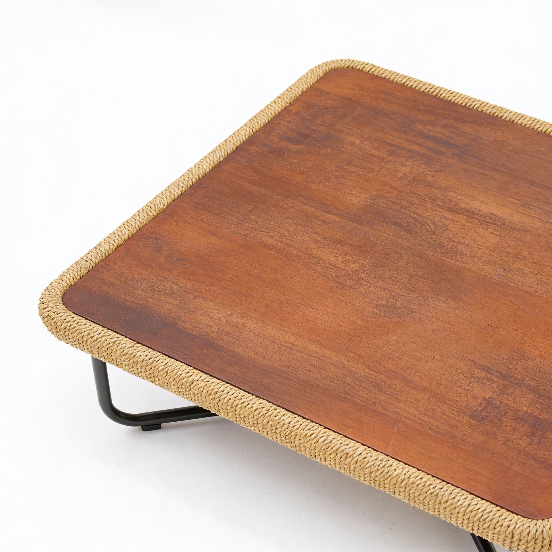 Wooden table with woven edge on a white background