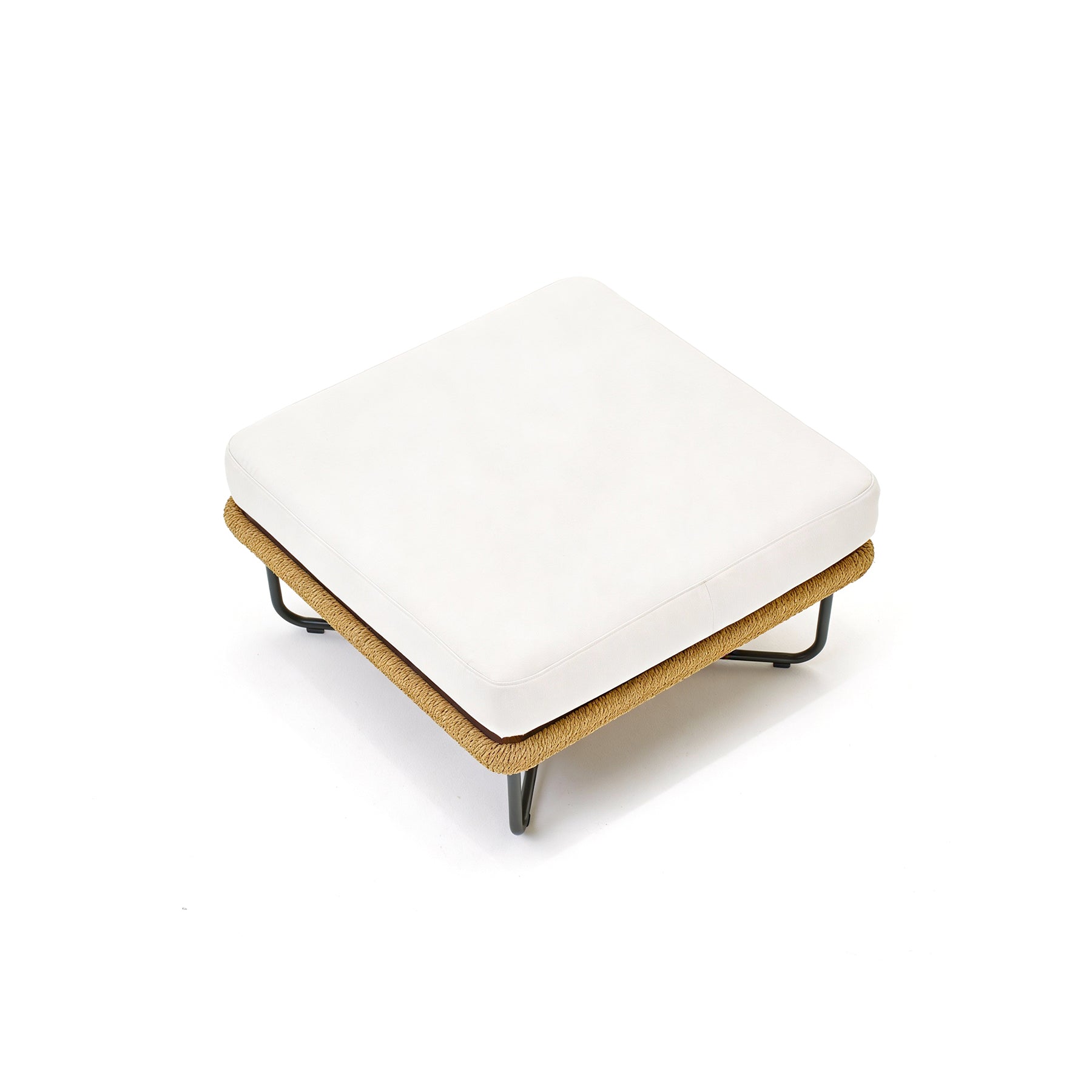 White cushioned ottoman with cork base on a white background