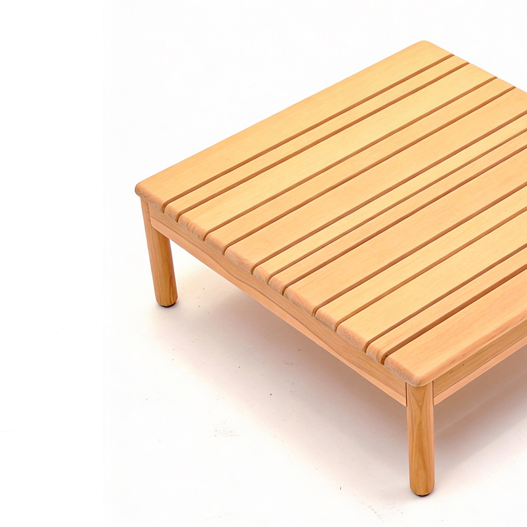 Wooden bench with slatted design on a white background