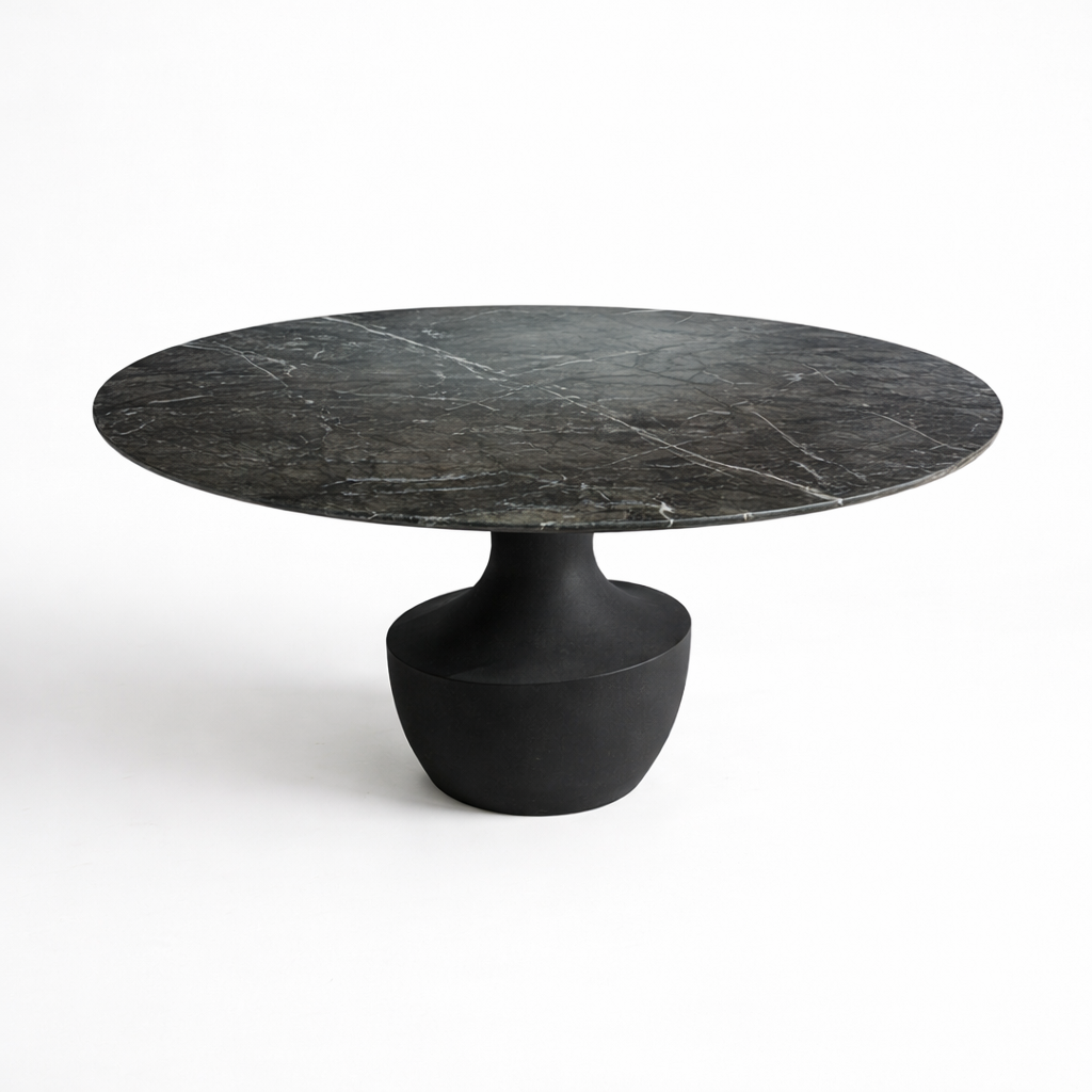 Round black marble table with a cylindrical base on a white background