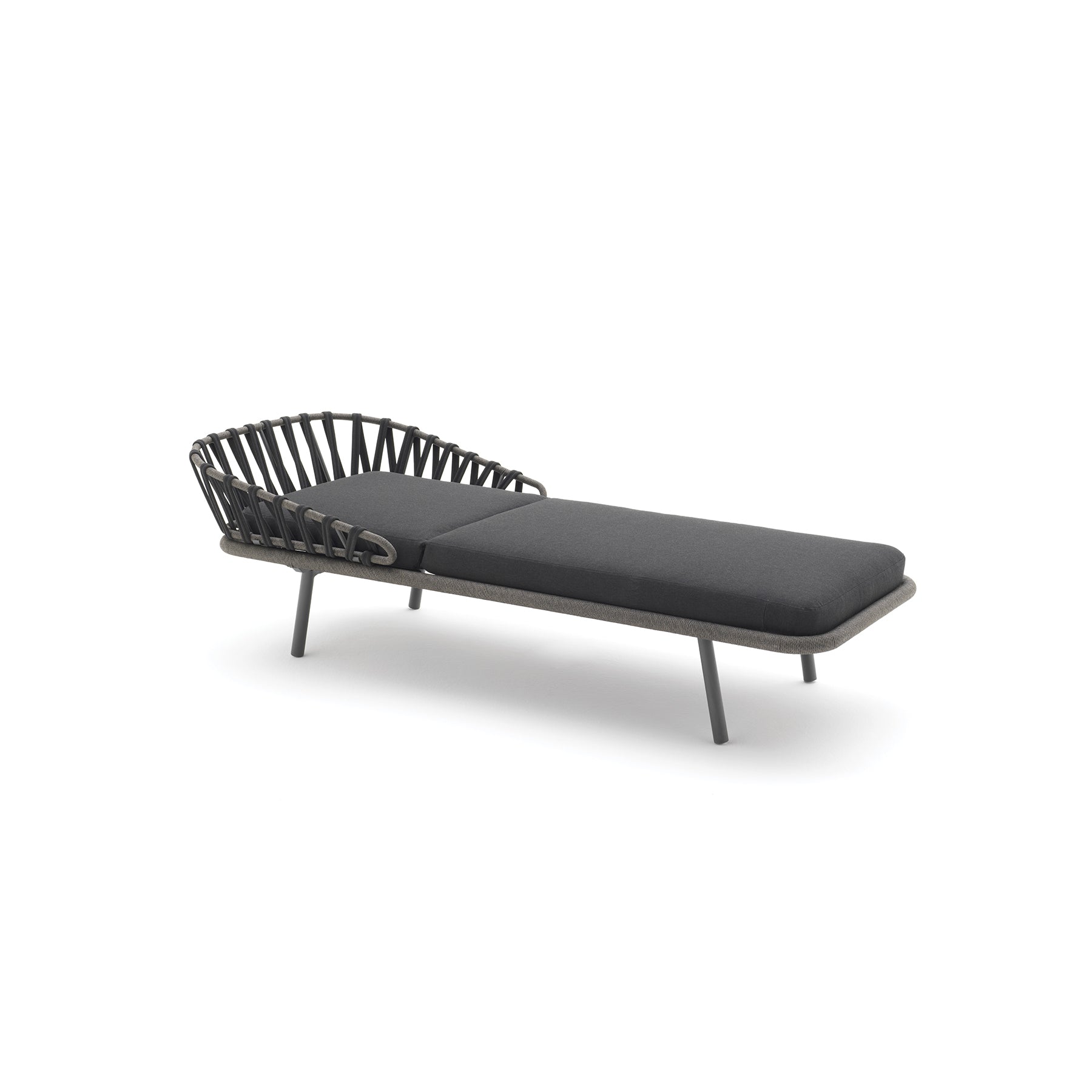 Modern outdoor lounge chair with black cushions on a white background