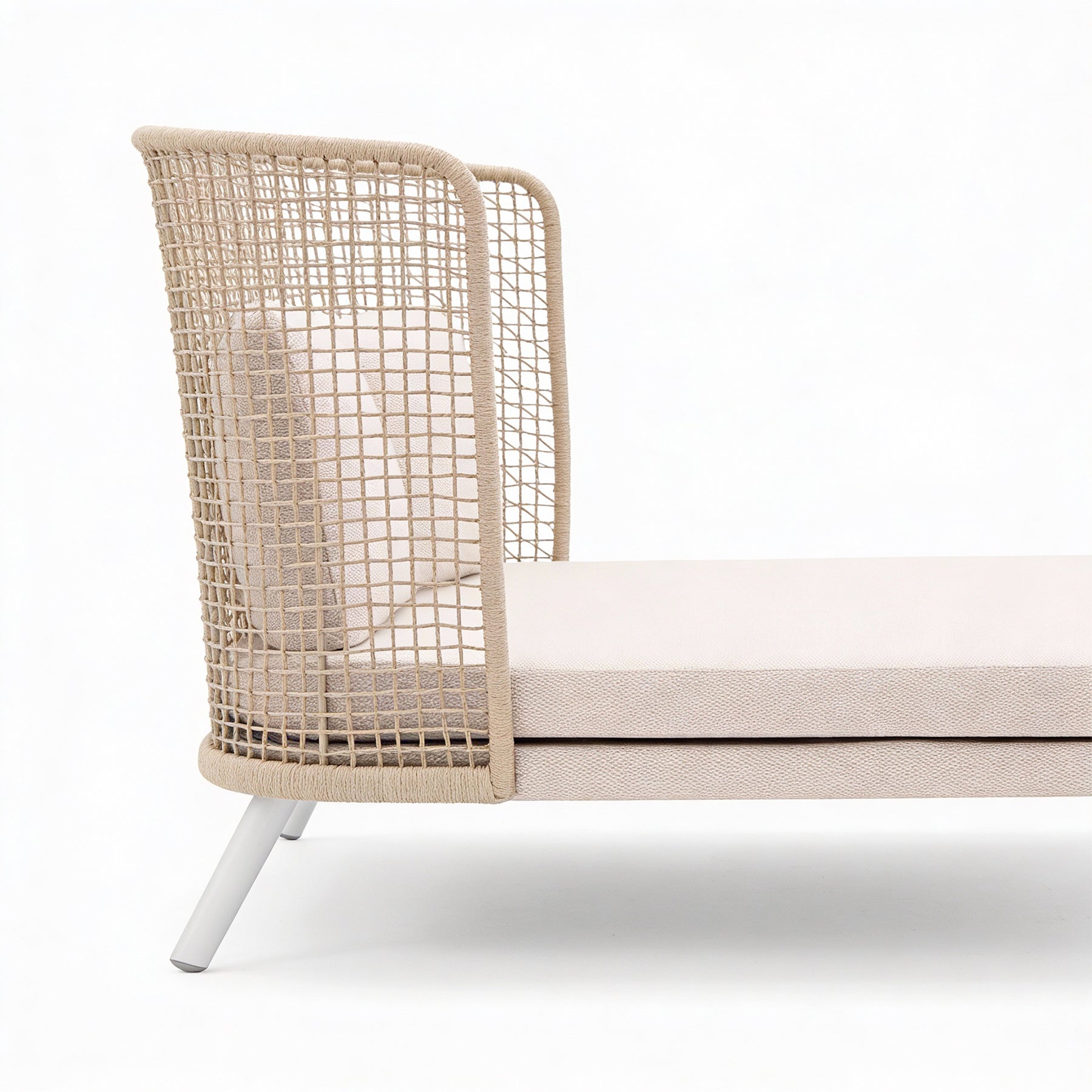 EMMA_DAYBED Wicker chair with white cushion on a white background