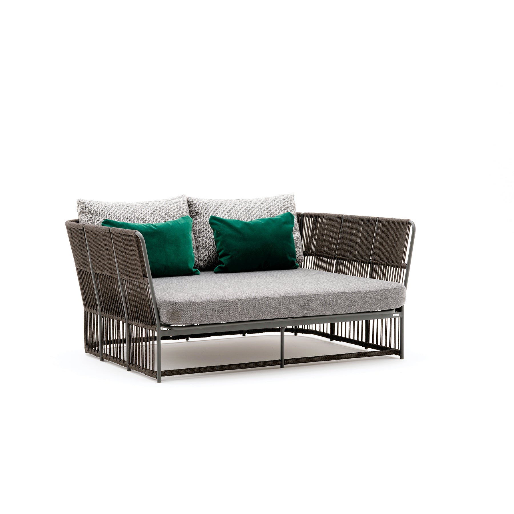 Modern outdoor sofa with wicker backrest and cushions on a white background