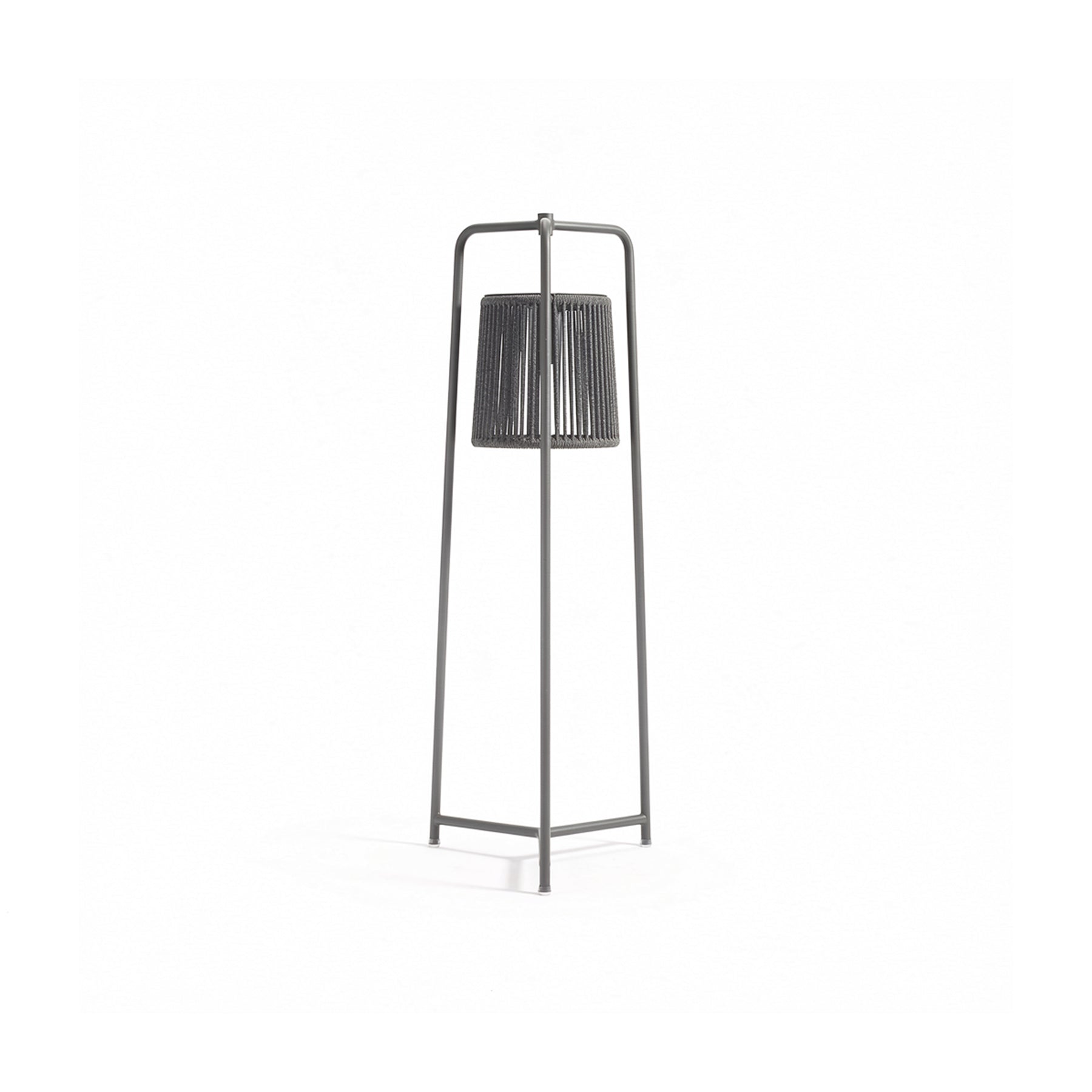 Black floor lamp with a cylindrical shade on a white background