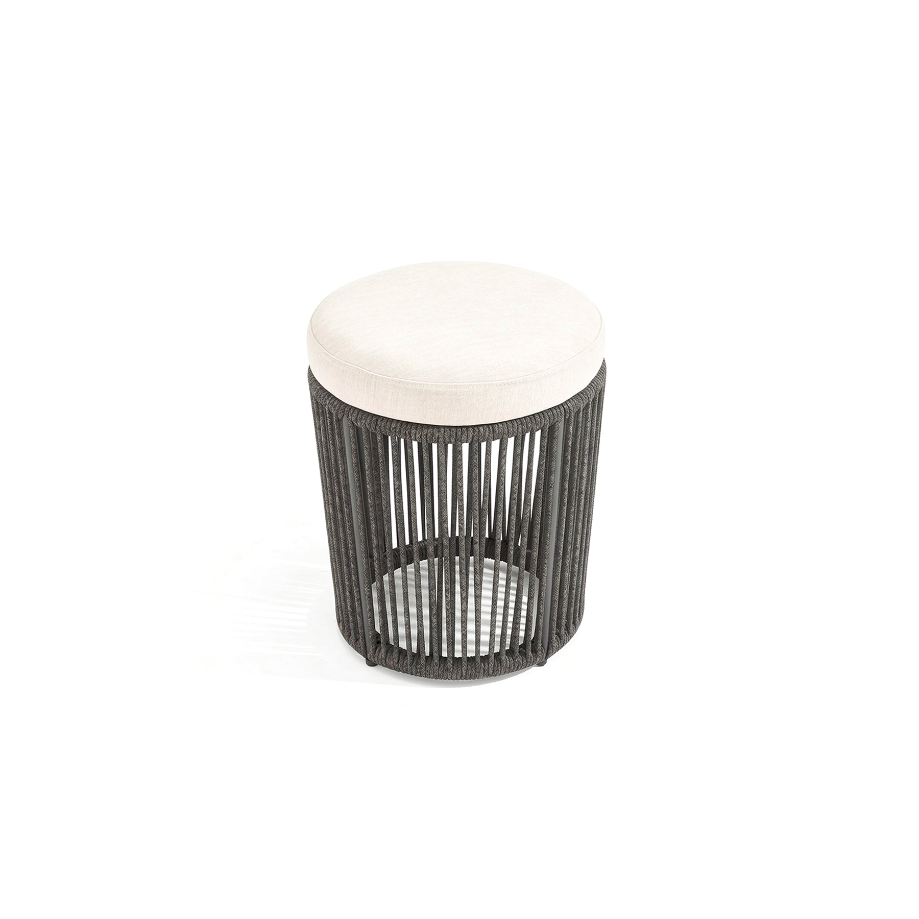 Small round stool with black woven design and white cushion on a white background
