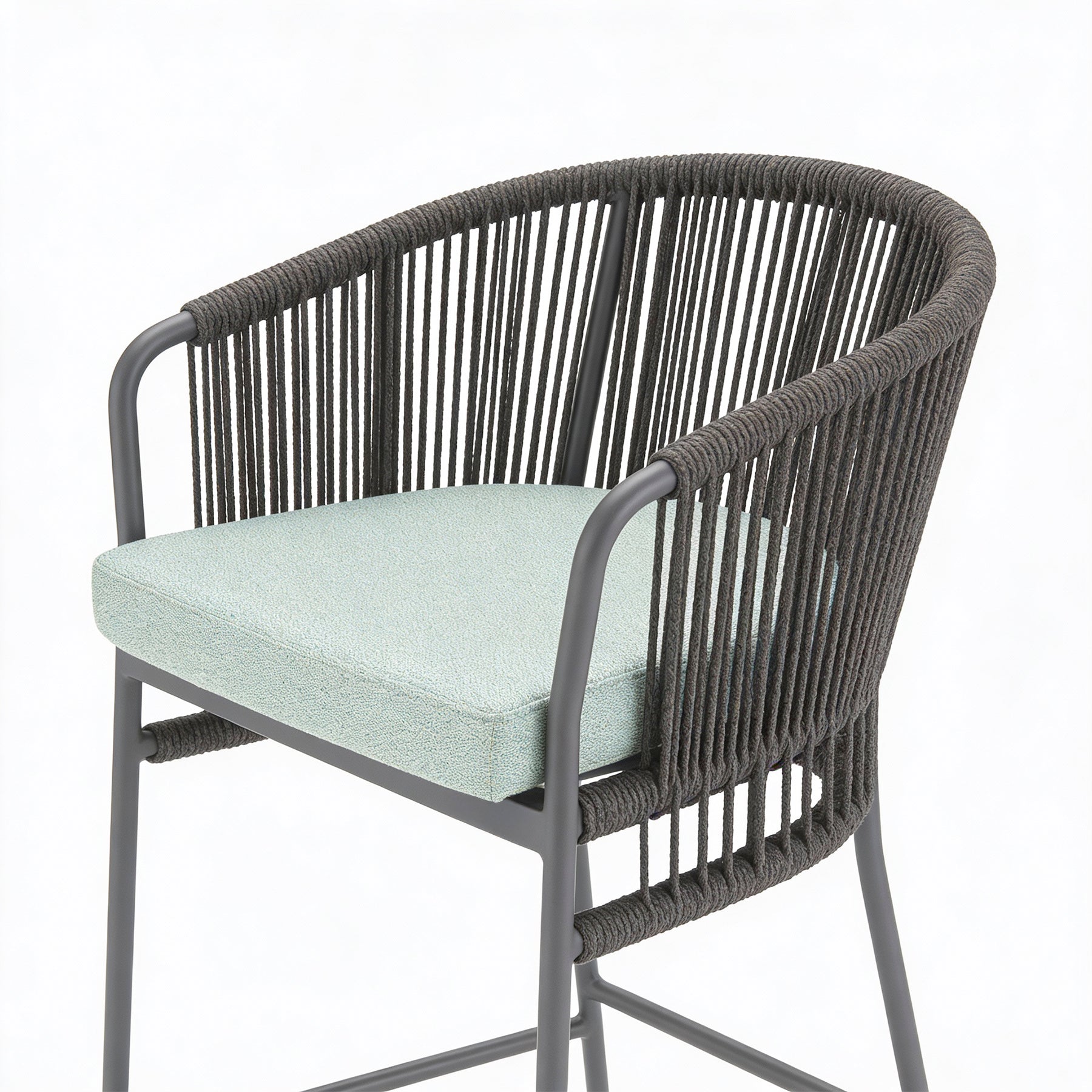 Chair with dark woven frame and light green cushion on a white background