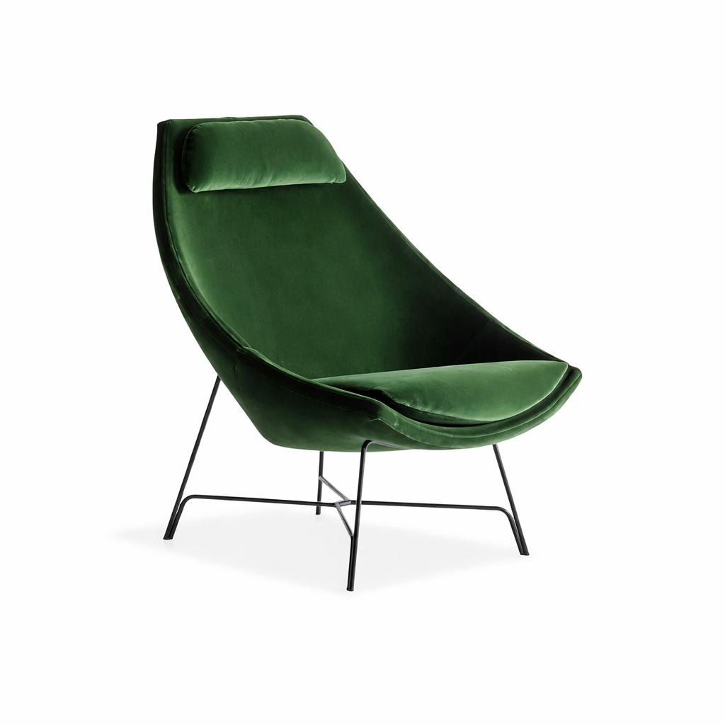 Green velvet chair with black metal legs on a white background