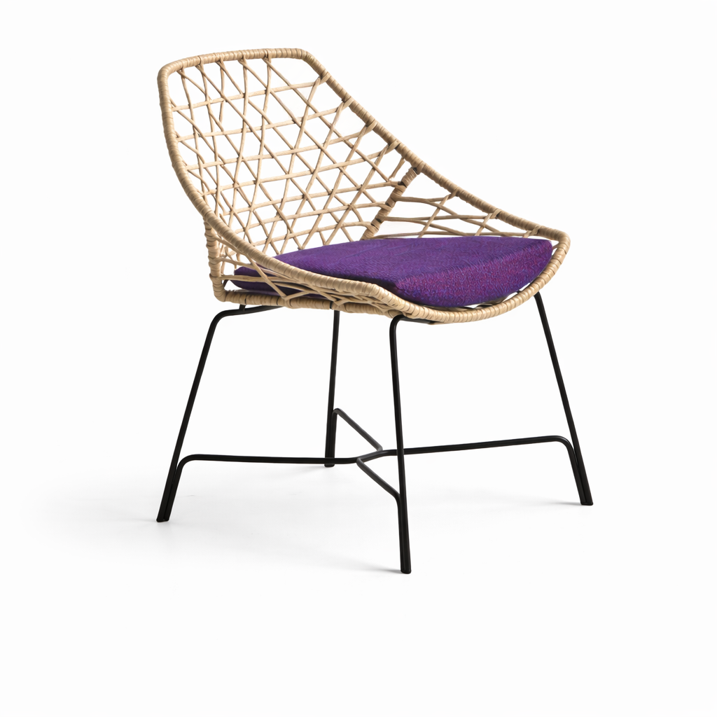Woven chair with a purple cushion on a white background