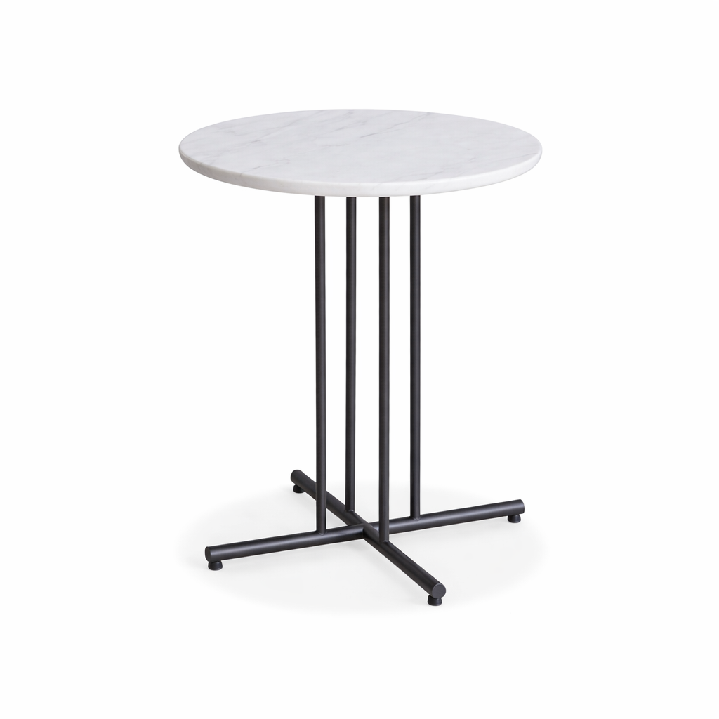 Round table with white marble-like top and black metal base on a white background