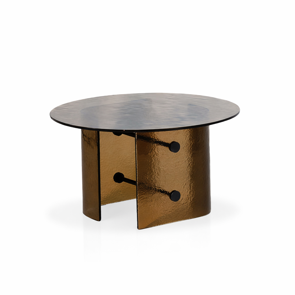 Bronze-colored round table with a reflective surface on a white background