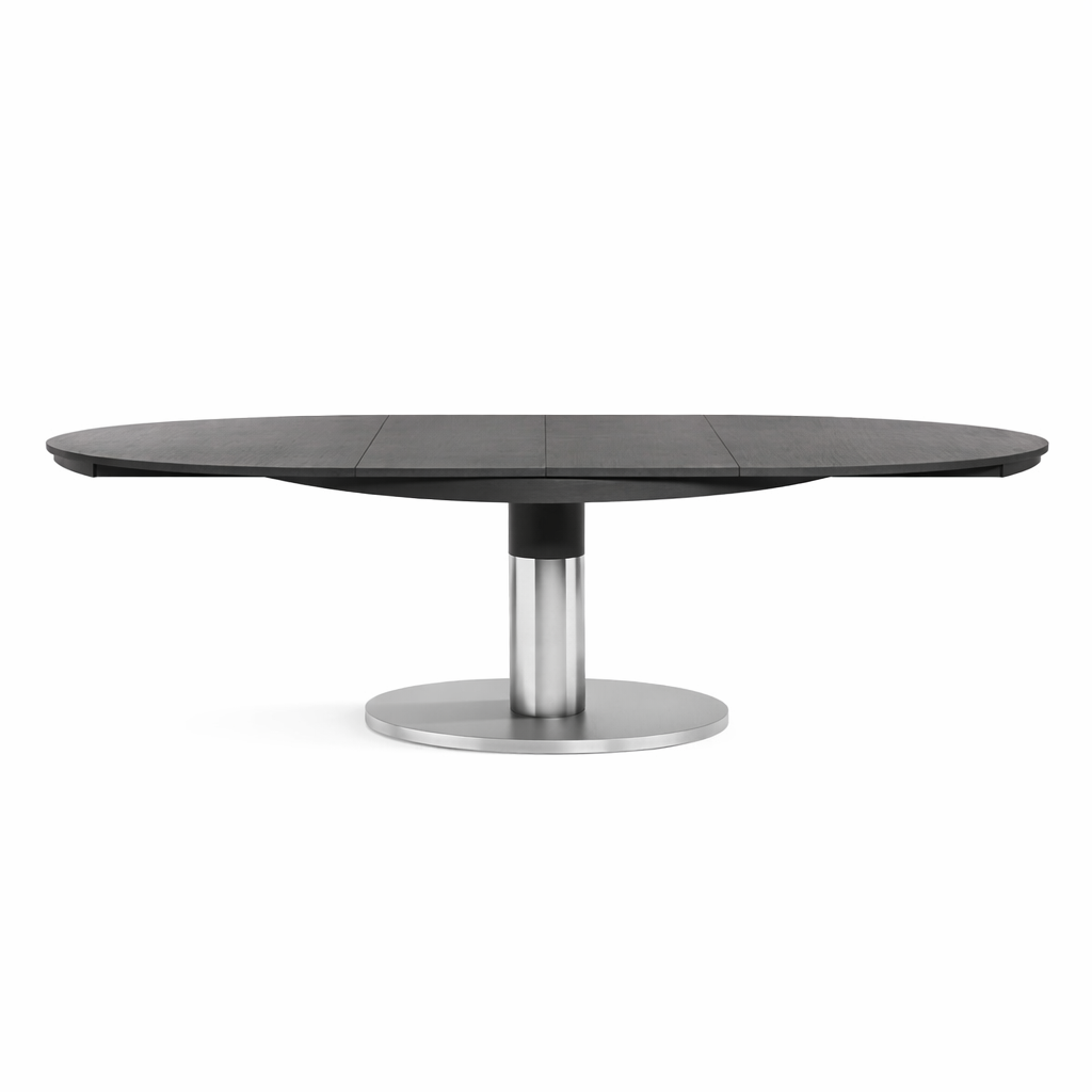 Round black dining table with a metallic base on a white background