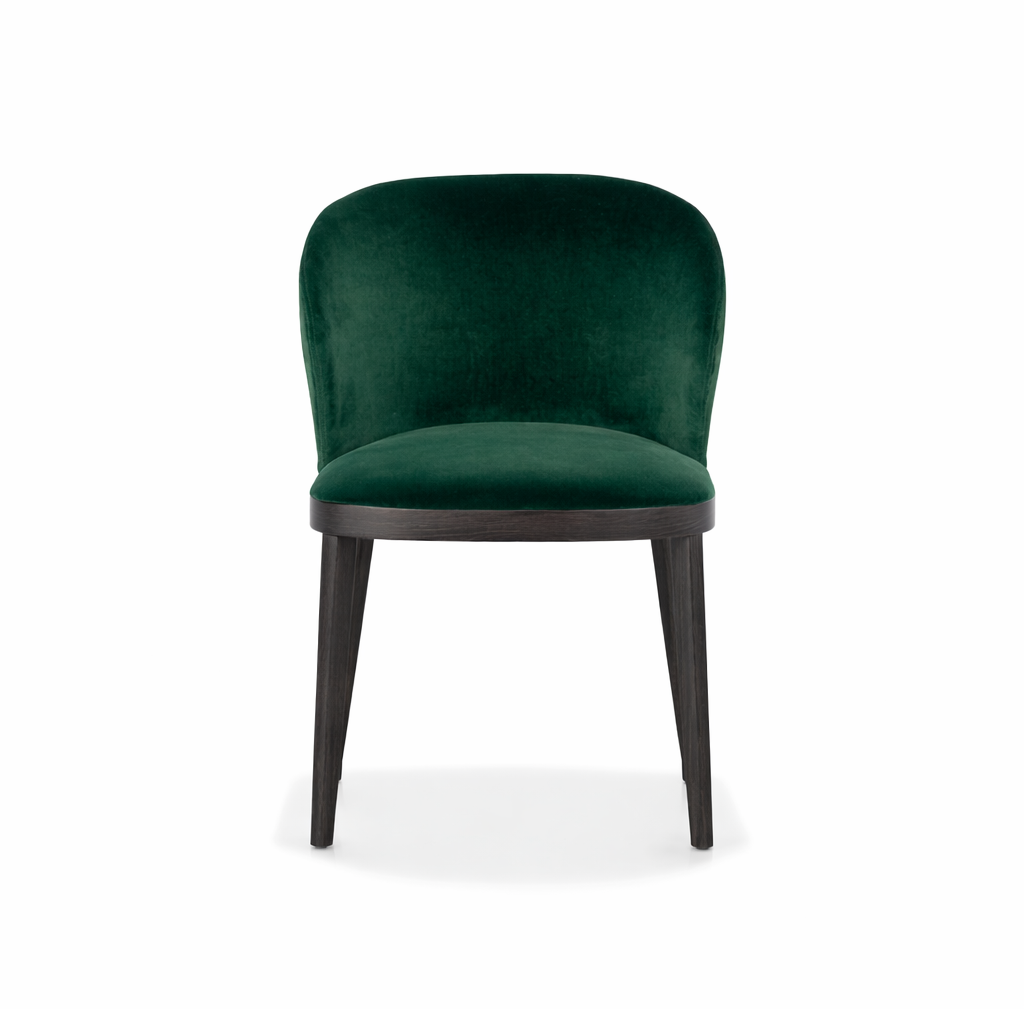 Green velvet chair with dark wood legs on a white background
