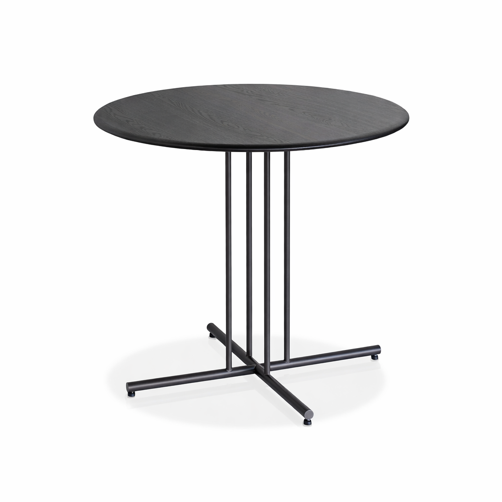 Round black table with a metal base on a white background