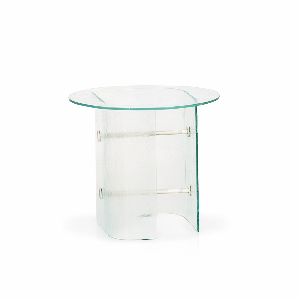 Glass side table with a curved design on a white background
