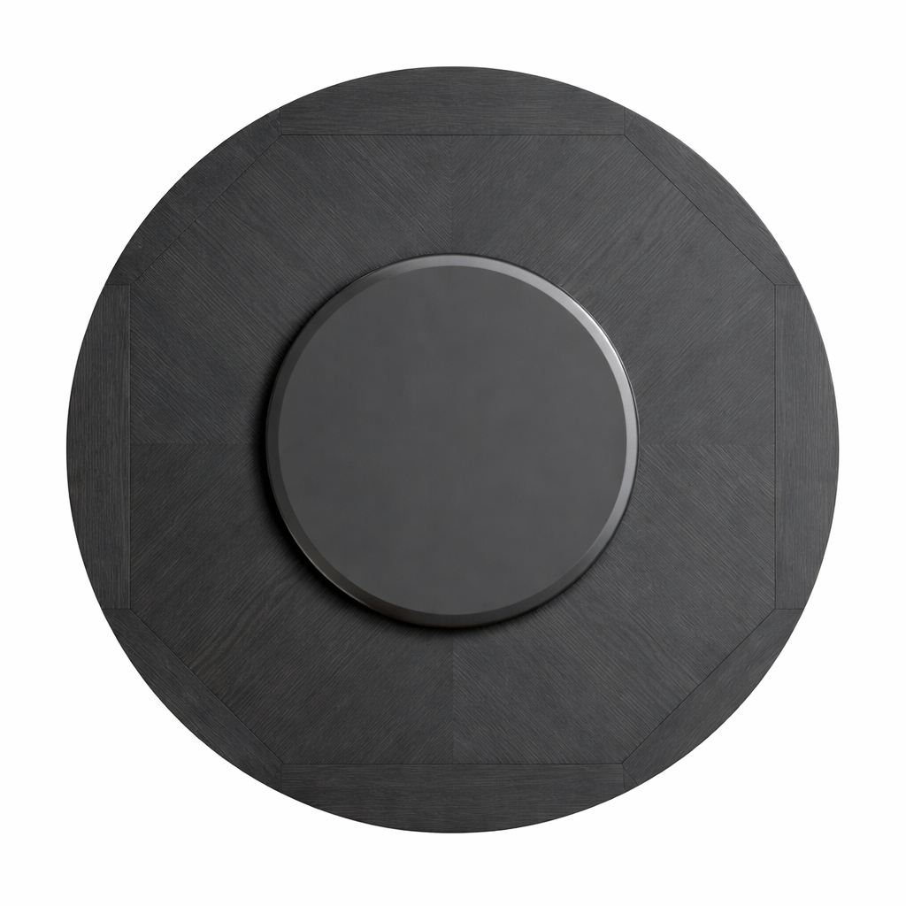 Round black object with a central circular component on a white background