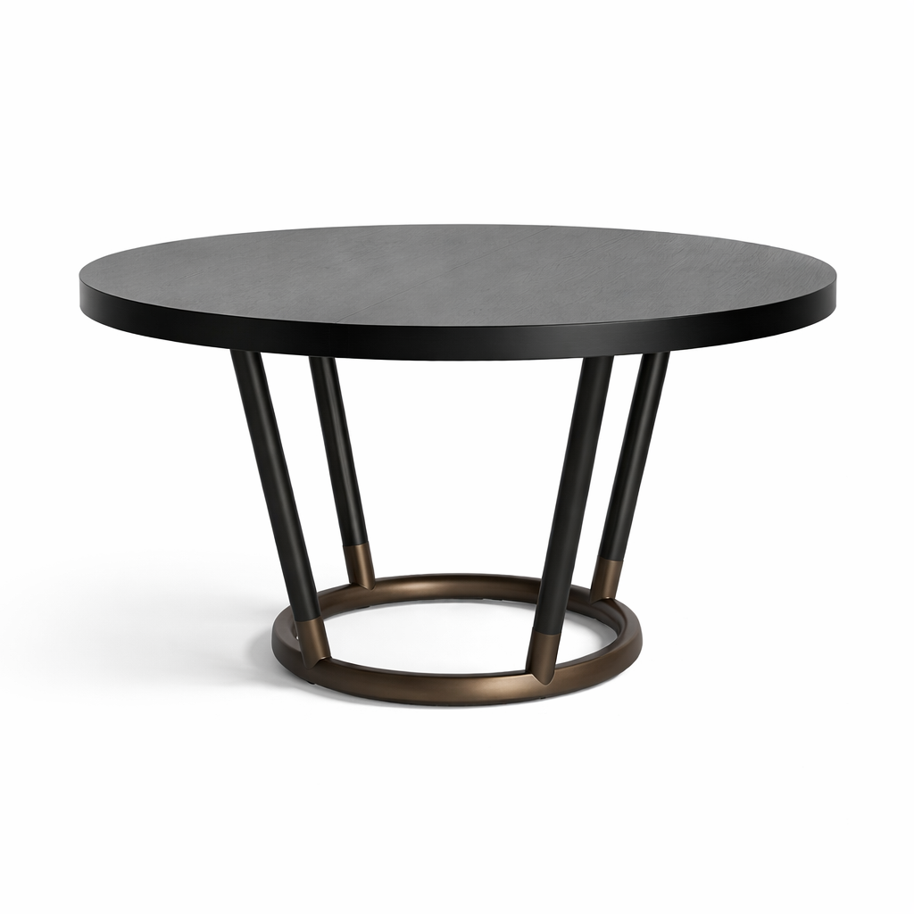 Round black table with bronze metal base on a white background