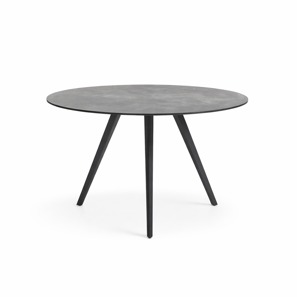 Round table with a gray concrete top and black metal legs on a white background