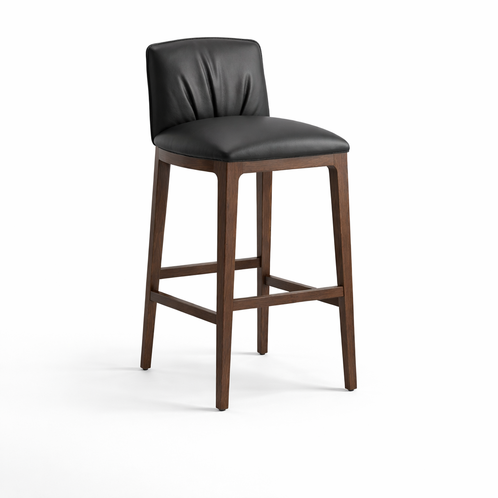 Bar stool with black cushioned seat and wooden legs on a white background