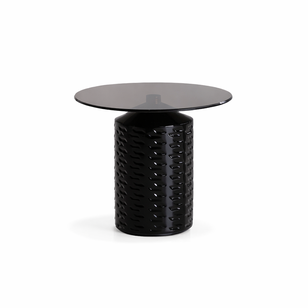 Black textured side table with a round glass top on a white background